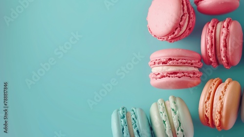 Assorted macarons arranged on blue background photo