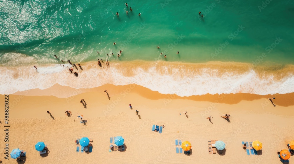 Top view of the beach with sun umbrellas and people sunbathing and swimming in the ocean. Top view of the beach with sun umbrellas and people sunbathing and swimming in the ocean.