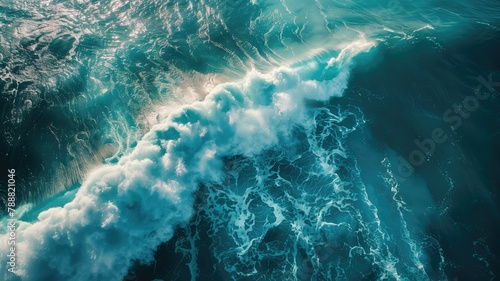Aerial view of ocean waves with frothy foam