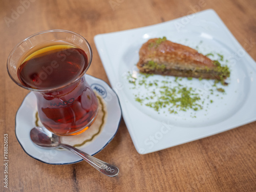 turkish tea and sweets on the white plate in the cafe of istanbul