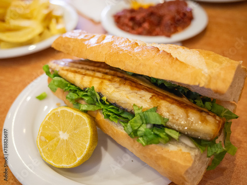 turkish mackerel sandwich on the table of restaurant in istanbul