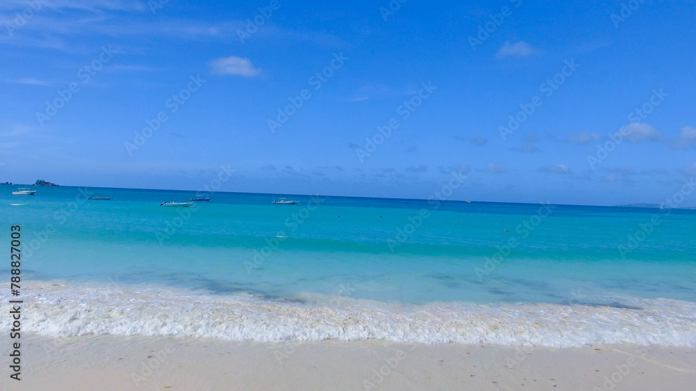 Praslin Beach, Seychelles. Aerial view of tropical coastline on a sunny day Praslin Beach, Seychelles. Aerial view of tropical coastline on a sunny day
