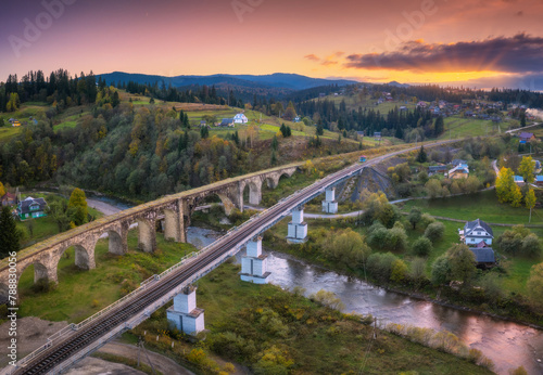 Beautiful old viaduct at sunset in carpathian mountains in autumn