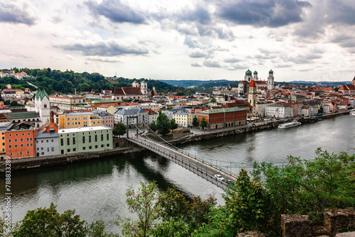 Panoramic view of Passau. Top view of suspension bridge. Aerial skyline of old town with beautiful reflection in Danube river, Bavaria, Germany.