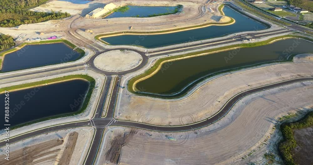 Large development area of residential housing. New suburbs ready for house construction on prepared soil in Florida. Real estate market in the USA Large development area of residential housing. New suburbs ready for house construction on prepared soil in Florida. Real estate market in the USA