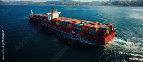 Aerial view of a large container ship sailing in the sea.