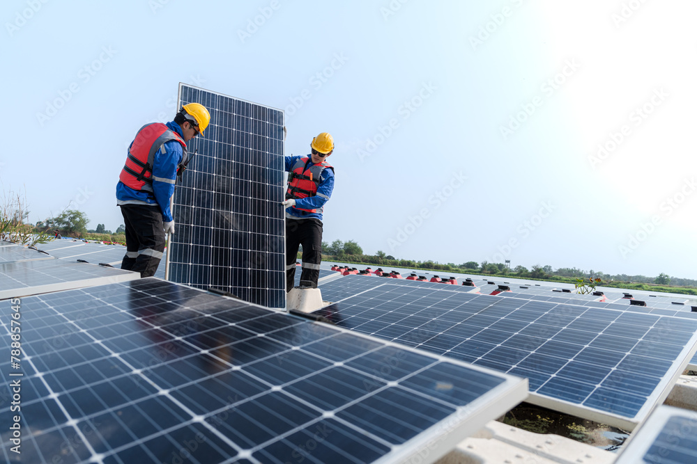 custom made wallpaper toronto digitalMale workers repair Floating solar panels on water lake. Engineers construct on site Floating solar panels at sun light. clean energy for future living. Industrial Renewable energy of green power.