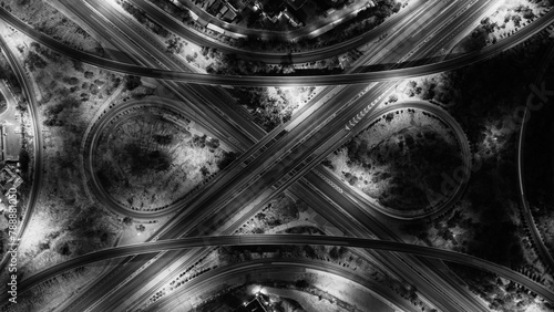Paved asphalt roads and streets, a black and white overhead photo of car traffic on the general ring road in the State of Kuwait, highway street photo from the sky, infinity shape road