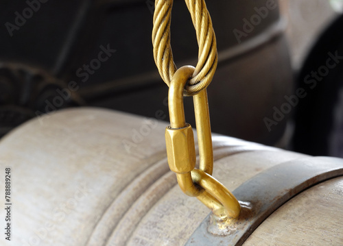 Gold Stainless steel a snap-hook on cable. Detail of rope end. 