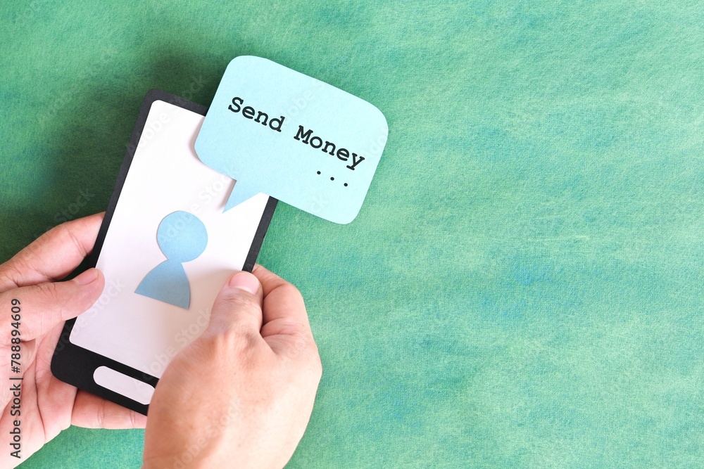 Send money text message smishing scam and ransom concept. Hand holding mobile phone with message from unknown sender.