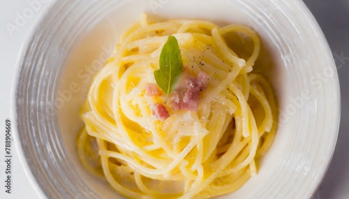 Spaghetti cabonara on a white plate. Top view.
 photo