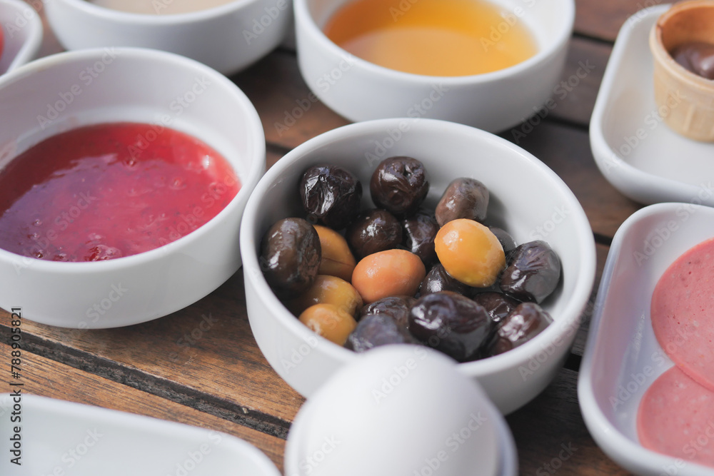 Collection of black and green olives with leaves. Collection of black and green olives with leaves.