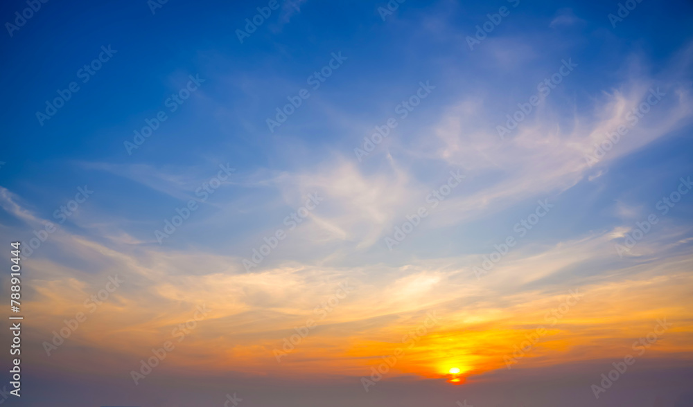 Colorful cirrus cloudy sky at sunset. Gradient warm cold color. Sky texture, abstract nature background