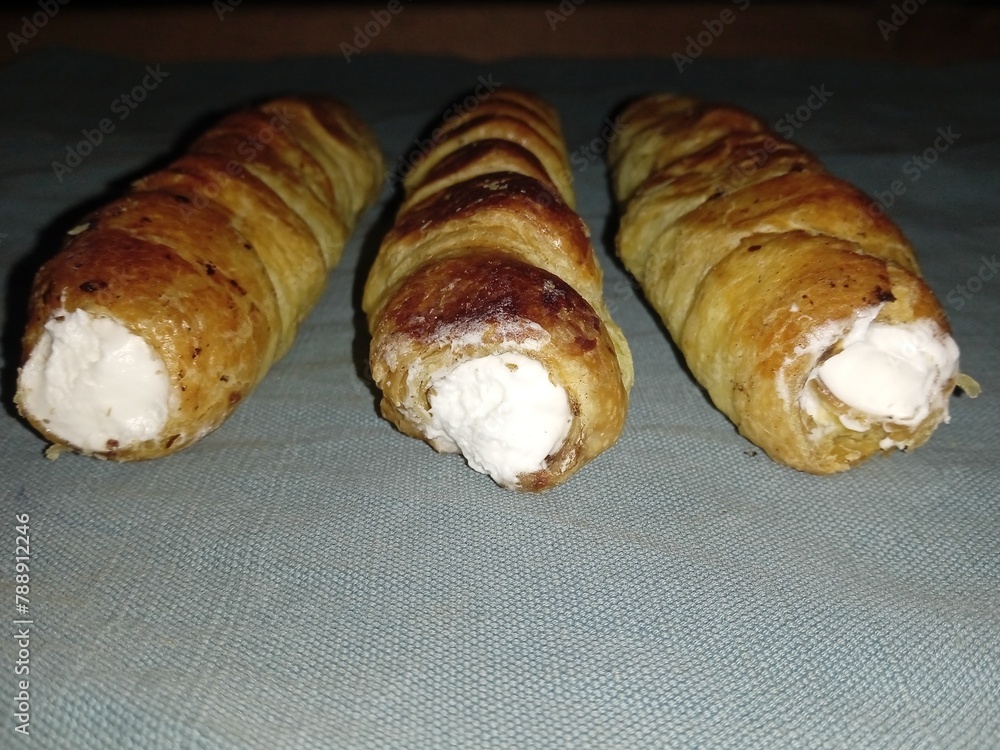 Bakery item, baked sweet rolls on grey background, sweet food 