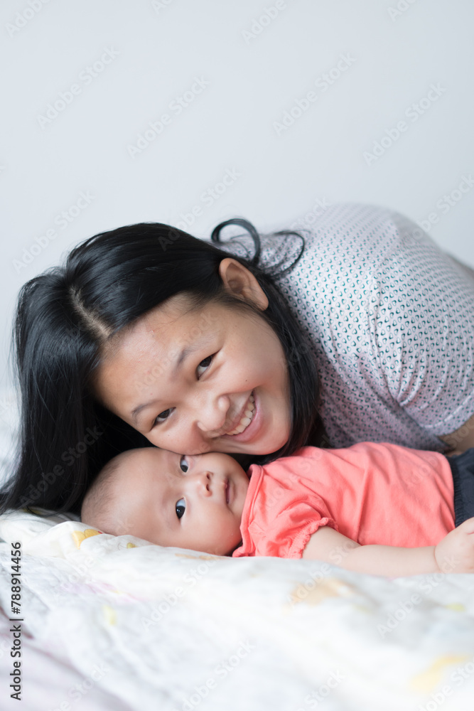 Infant Girl with Asian Mother Infant Girl with Asian Mother