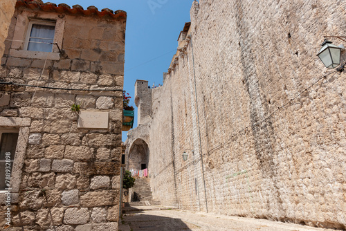 Inside wall of medieval city high wall leads to steps © Brian Scantlebury