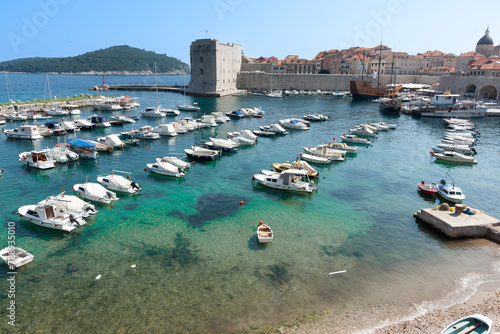 Mediterranean sea and marina outside walls of  medieval walled city of Dubrovnik