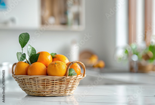 Some oranges in a basket  A basket of orange put on the wood table in the kitchen. © suthiwan