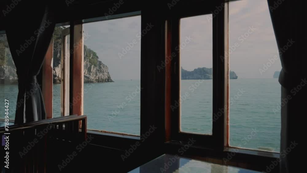 Shot of Lan Ha bay from the window of a boat in Vietnam . Shot of Lan Ha bay from the window of a boat in Vietnam .