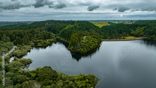 Drone perspective of Lake Mangamahoe Taranaki surrounded by forest