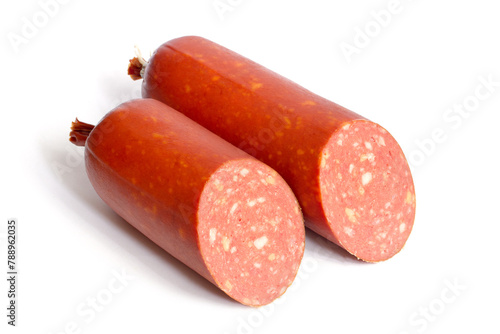 Two halves of smoked salami sausage with cheese on a white background. Fresh chopped sausage close-up.