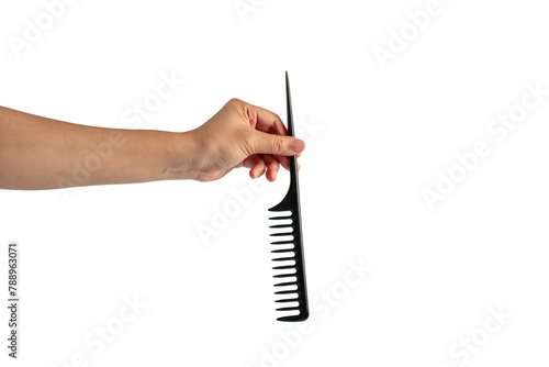 Black hair comb in hand isolated on transparent background