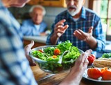 older Engaged in a Heated Argument Over Salad at Dining Table - Relationship Conflict Concept