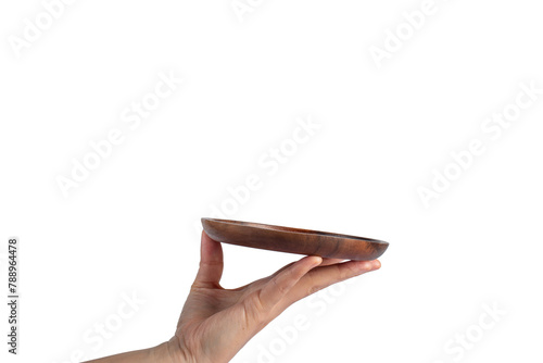 Wooden plate in hand on transparent background.