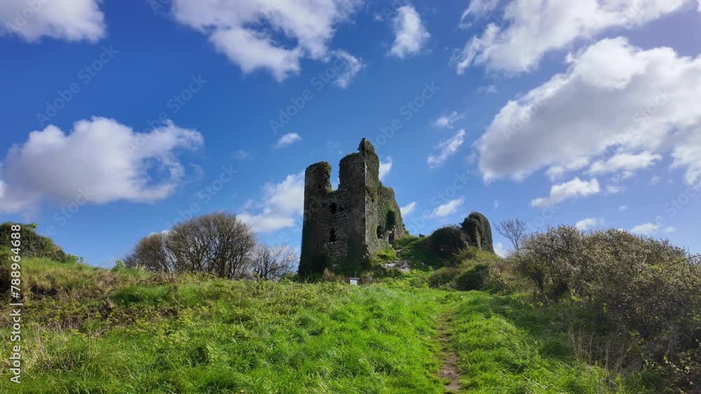 Castle ruins on the hill,historic site Dunhill Castle Waterford Ireland historic past and now a tourist attraction in rural idyllic landscape Castle ruins on the hill,historic site Dunhill Castle Waterford Ireland historic past and now a tourist attraction in rural idyllic landscape