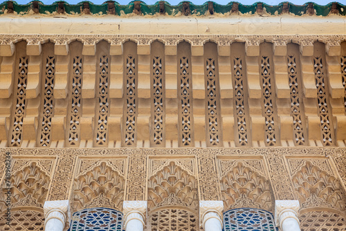 Wooden, ceramic and stone ornates on building facade