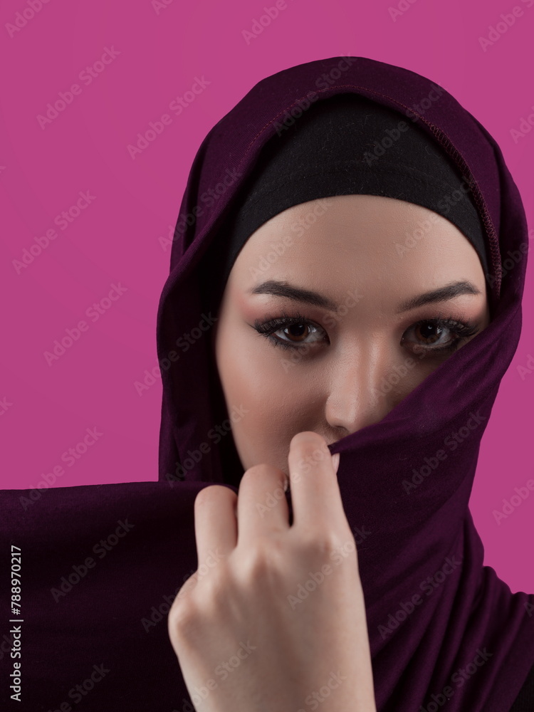 Modern Muslim woman wearing stylish hijab casual wear isolated on pink background. Diverse people model hijab fashion concept. Modern Muslim woman wearing stylish hijab casual wear isolated on pink background. Diverse people model hijab fashion concept.