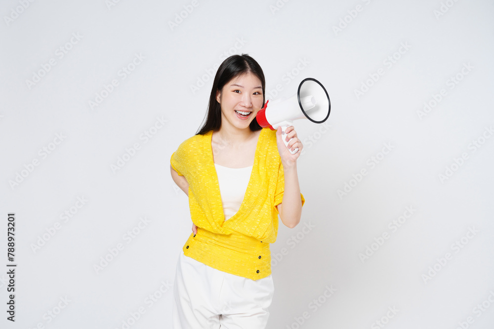 Young Asian woman holding megaphone isolated on white background, Speech and announce concept. Young Asian woman holding megaphone isolated on white background, Speech and announce concept.