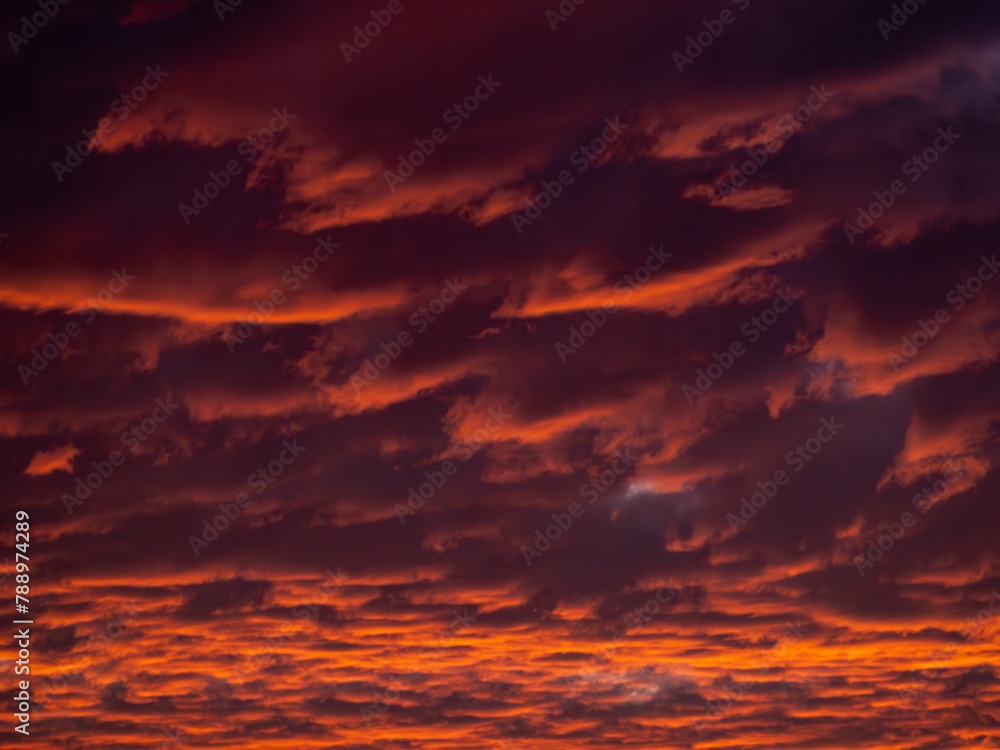 Fototapeta premium Fire stormy burning dramatic sky clouds twilight evening magenta red sunset dark moody overcast