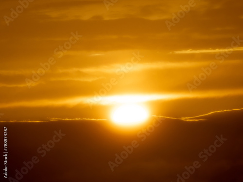 Last rays of light sun disappear end day dramatic sunset mountains evening orange sky © Dan Badiu