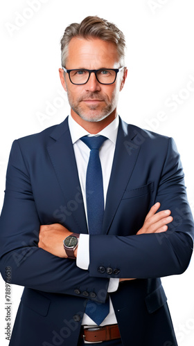 A man in a suit and tie standing with his arms crossed.