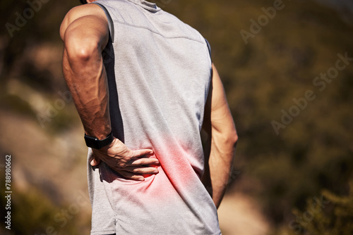 Man, runner and back pain in nature, injury and hurt outdoors on exercise or workout and accident. Male person, inflammation and fibromyalgia or sciatica issue, spine and strain while hiking or walk