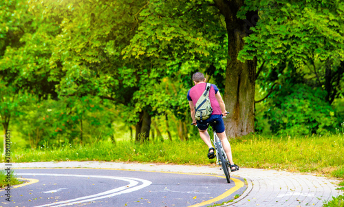 Cyclist ride on the bike path in the city Park 