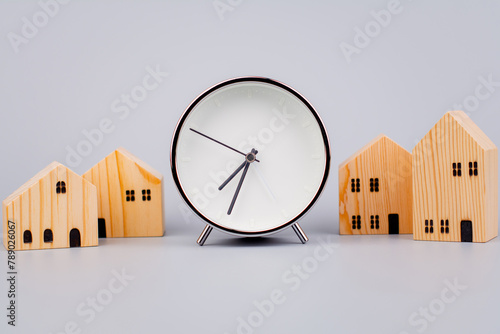 Time and houses, the time period for building a house and living in a house, charcoal pictures, clocks and houses