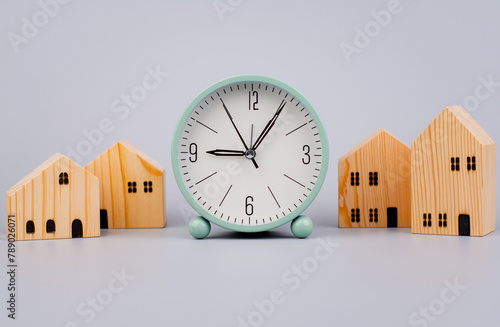 Time and houses, the time period for building a house and living in a house, charcoal pictures, clocks and houses