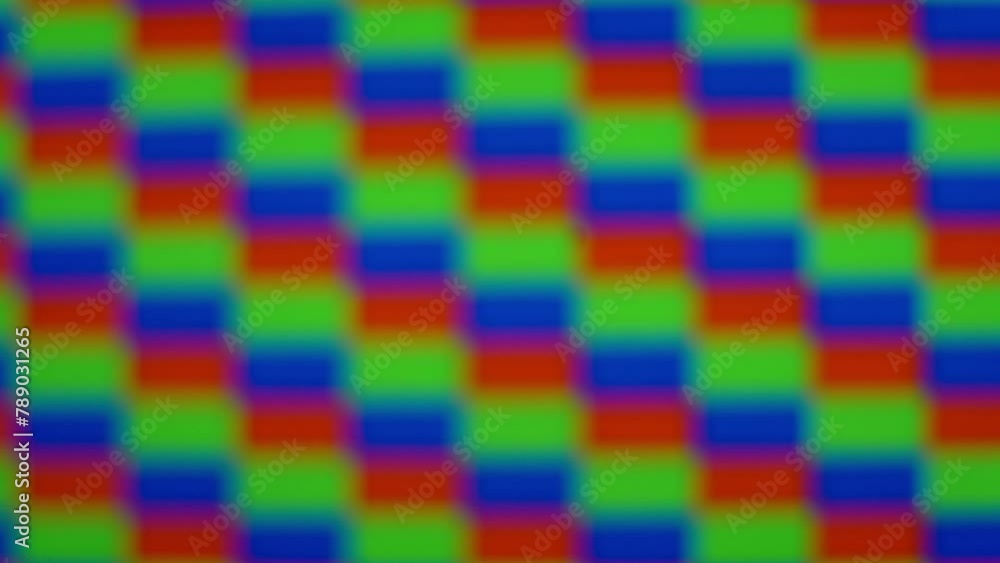 Close up of RGB rectangular pixels moving in a strobing pattern while slowly shifting in and out of focus. Close up of RGB rectangular pixels moving in a strobing pattern while slowly shifting in and out of focus.