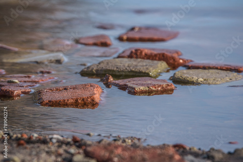 INUNDATION - Bricks and other materials in the water