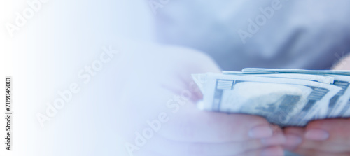 Person Holding Stack of Money, copy space.
