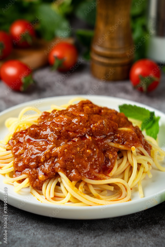 Traditional pasta spaghetti in plate on table. Traditional pasta spaghetti in plate on table.