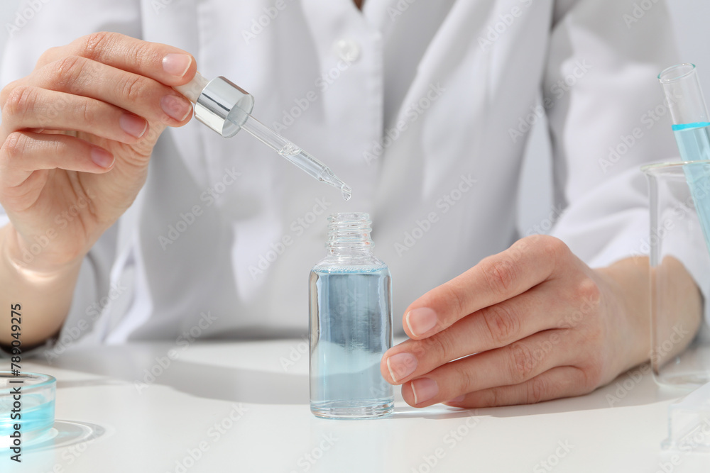 Cosmetics with chemical test tubes and pipette Cosmetics with chemical test tubes and pipette