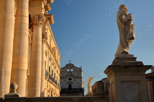 The sunset at Piazza del Duomo (Duomo Square), with the Duomo Cathedral and its columns on the left, Ortigia Island, Syracuse, Sicily, Italy photo