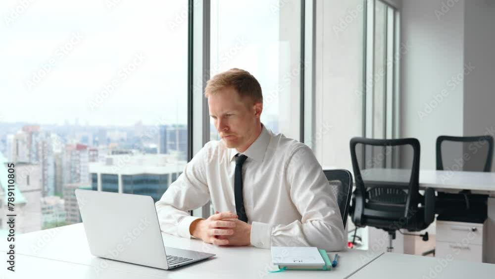 Busy professional business man employee, young male worker or executive, businessman entrepreneur wearing tie typing on computer technology using laptop working at office coworking near big window. Busy professional business man employee, young male worker or executive, businessman entrepreneur wearing tie typing on computer technology using laptop working at office coworking near big window.