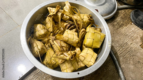 Ketupat Rice Dumpling Special Dish served at Eid Mubarak. Ketupat is Cooked Rice with Young Coconut Leaves Casing Eid al Fitr Moslem Celebration. Popular indonesian traditional Syawal food