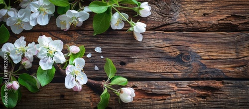 Apple blossoms on a wooden surface