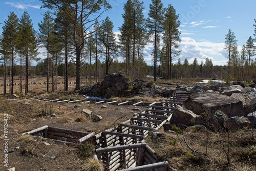 Preserved defensive WW2 trench at Salpa Line Vanttaja fortification are in springa, Kuusamo, Finland. photo