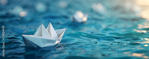 Origami Paper Boats Drifting on a Serene Blue River Showcasing Unique Direction and Leadership © Thares2020
